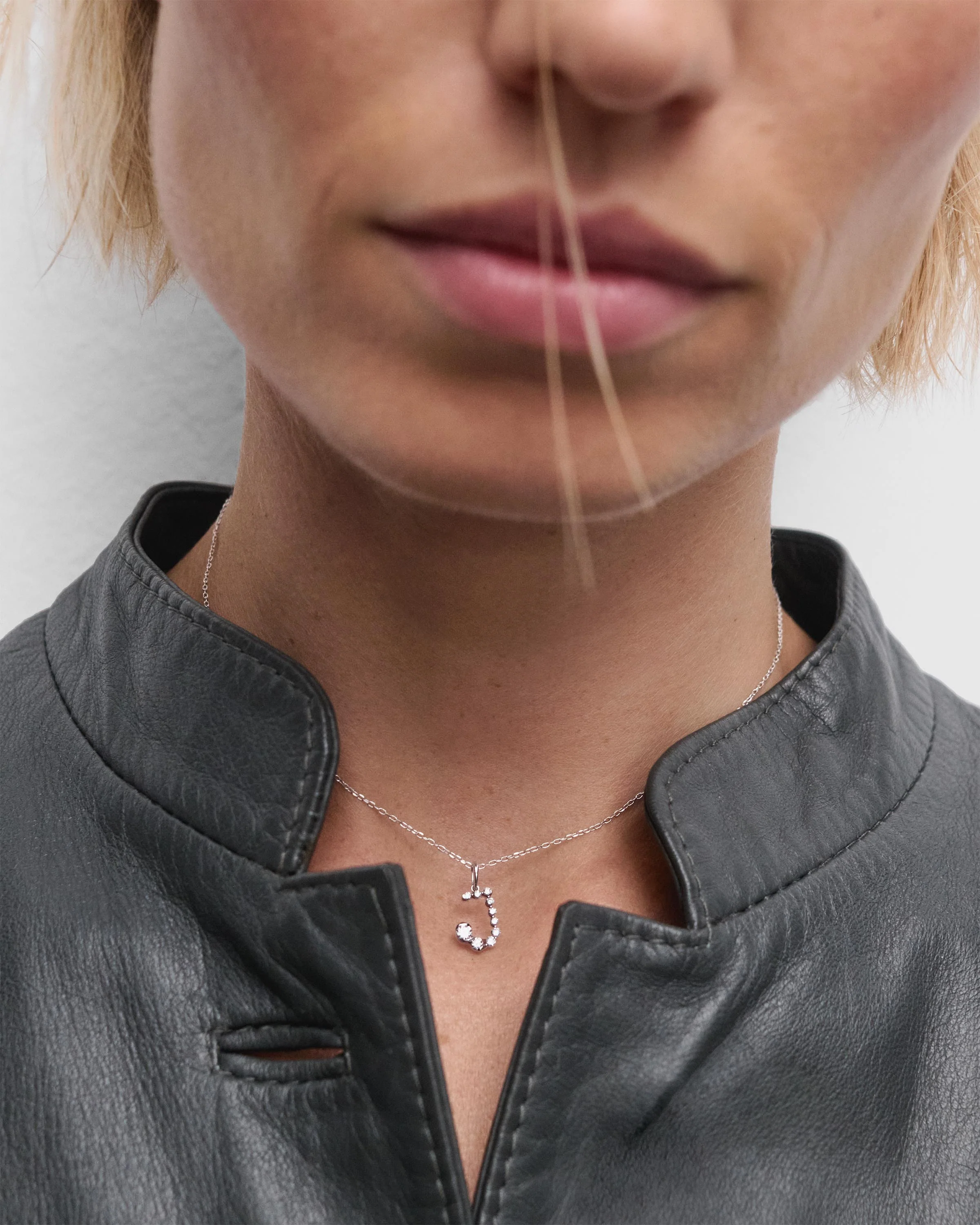 Diamonds and white gold J initial pendant
