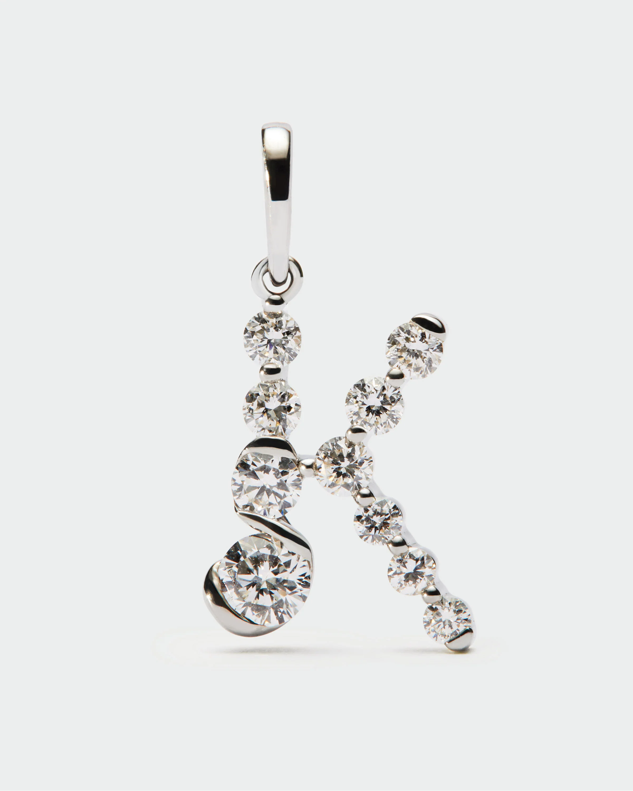 Diamonds and white gold K initial pendant