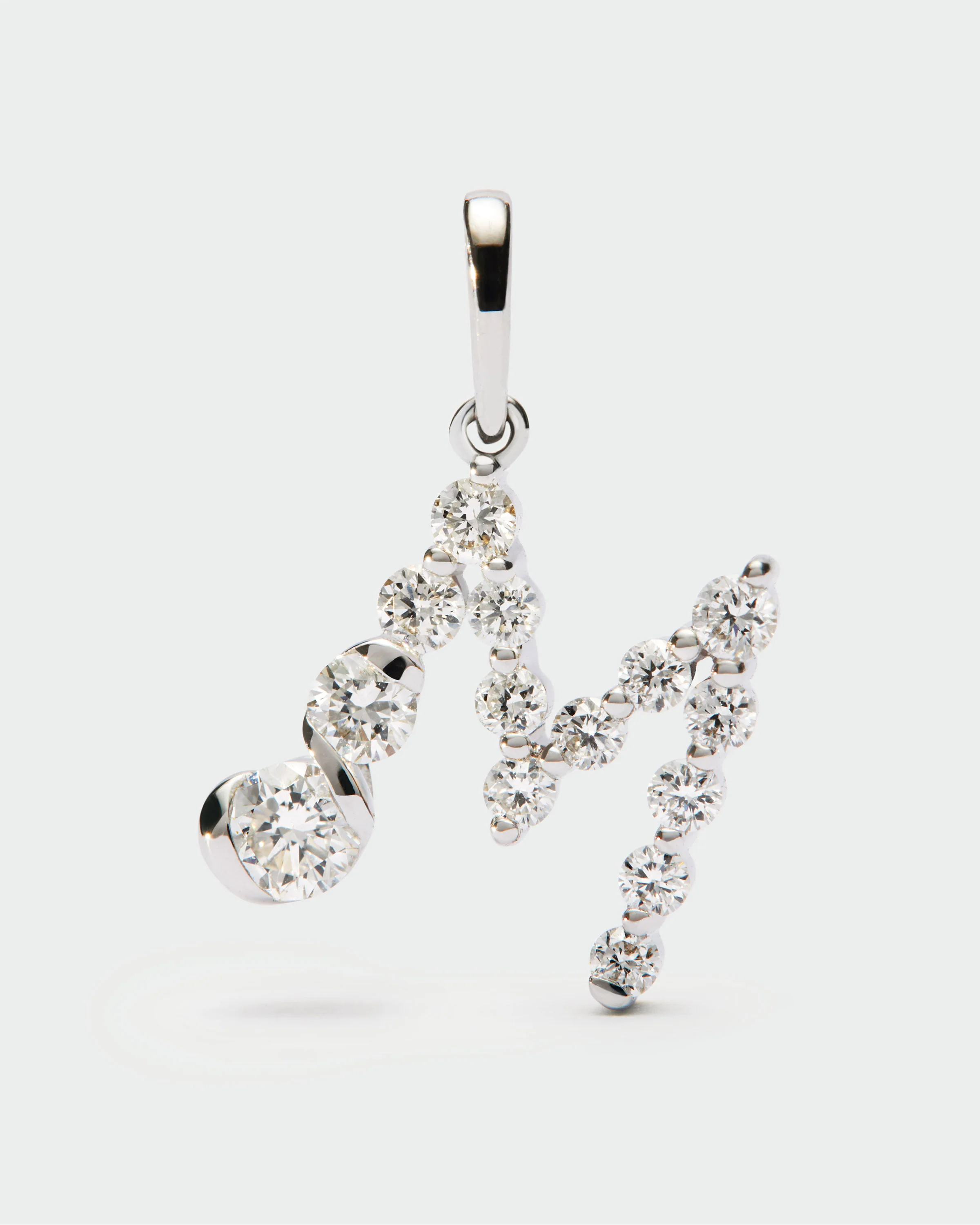 Diamonds and white gold M initial pendant