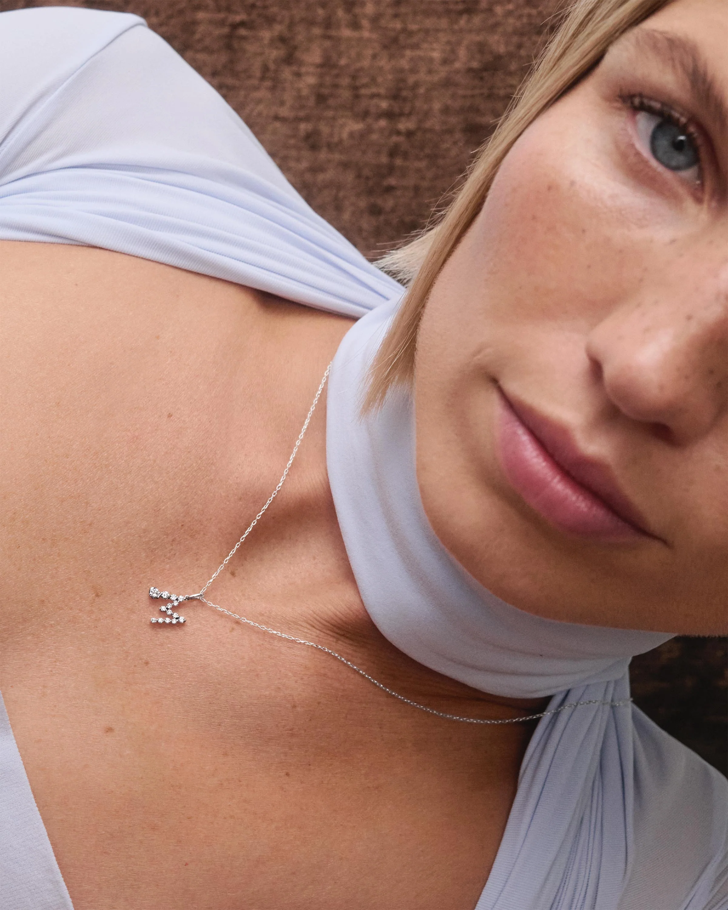 Diamonds and white gold M initial pendant