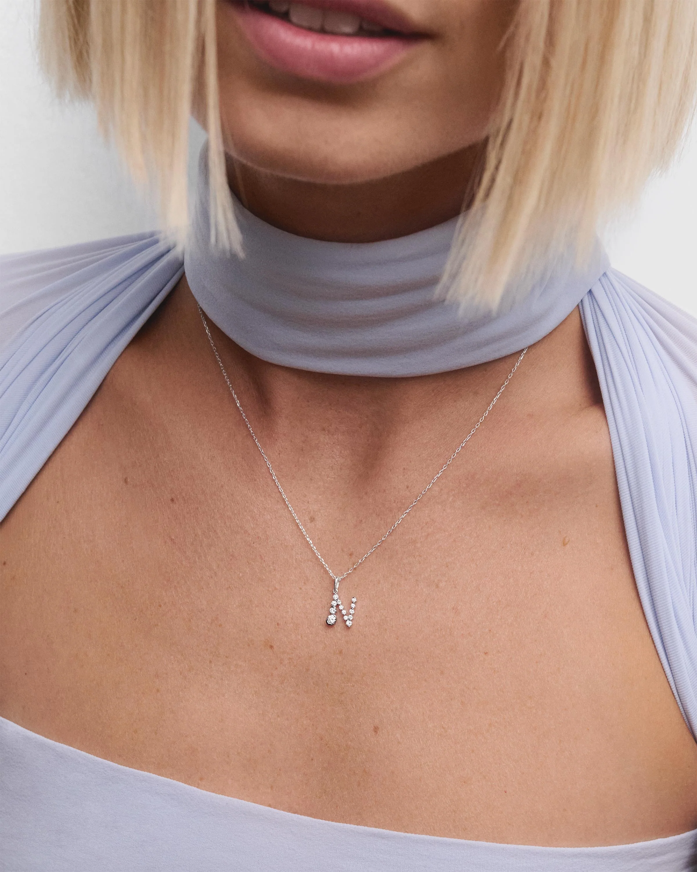Diamonds and white gold N initial pendant