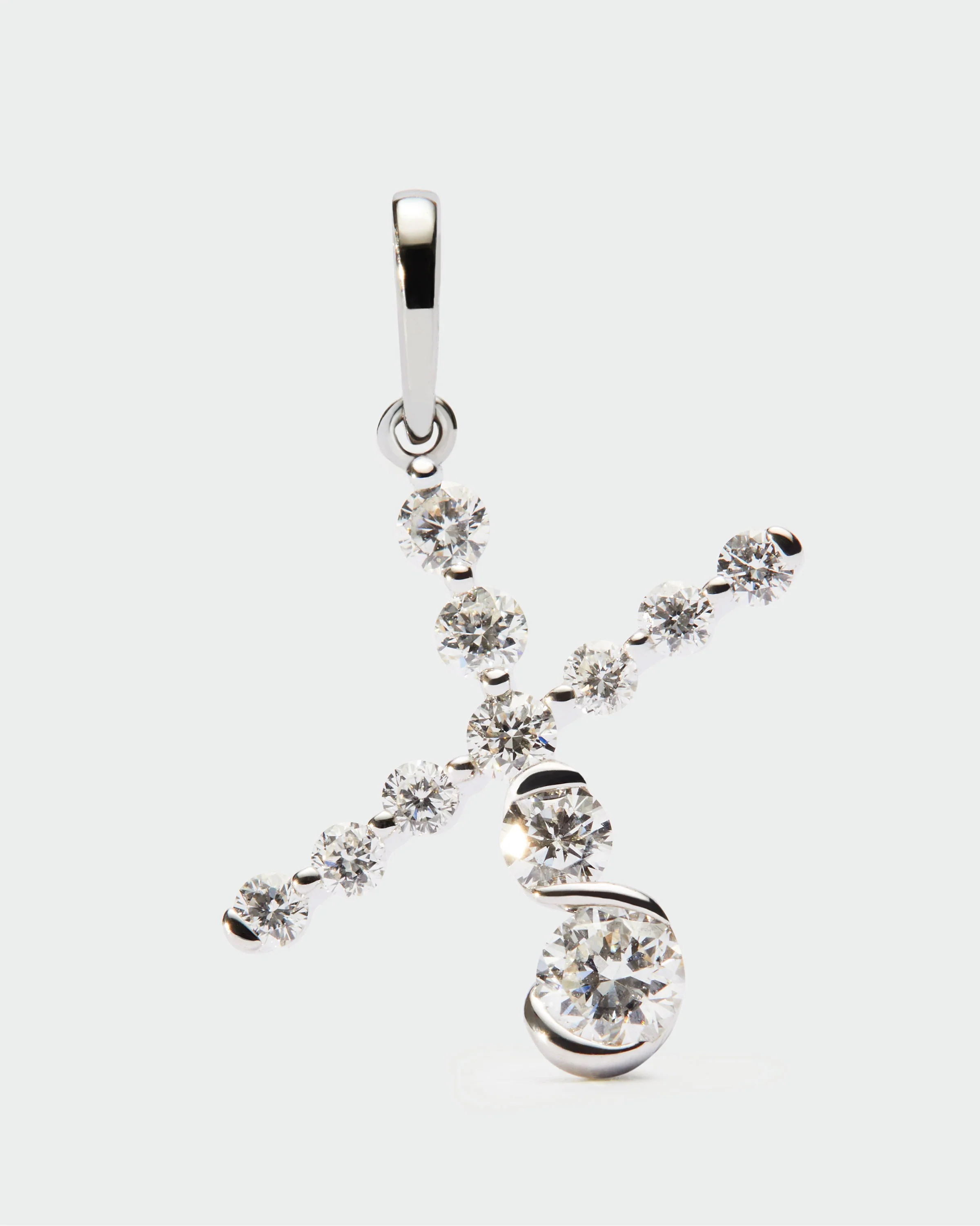 Diamonds and white gold X initial pendant